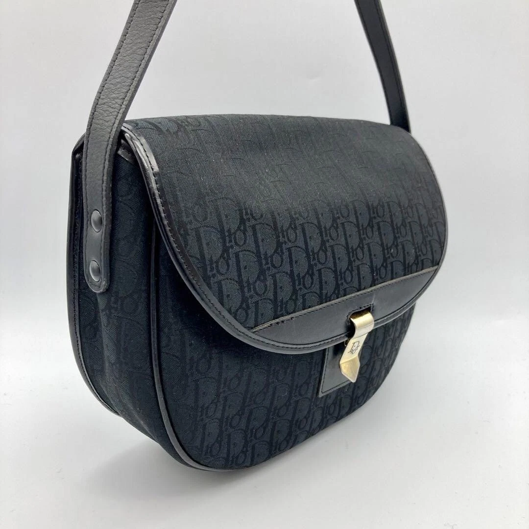 Sac bandoulière Dior motif trotteur ferrures métal doré noir noir