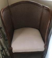 low armchair with cane backing