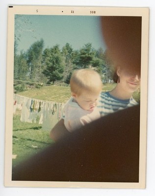 vintage snapshot photograph woman with child fingers on lens color