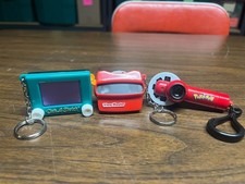 Used Keychains, Etch a Sketch, Viewmaster, pokemon projector slide show clip on