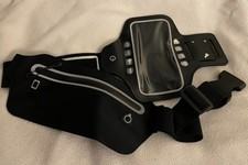 Phone holder and slim "bumbag". Opened but never used. Very good quality.