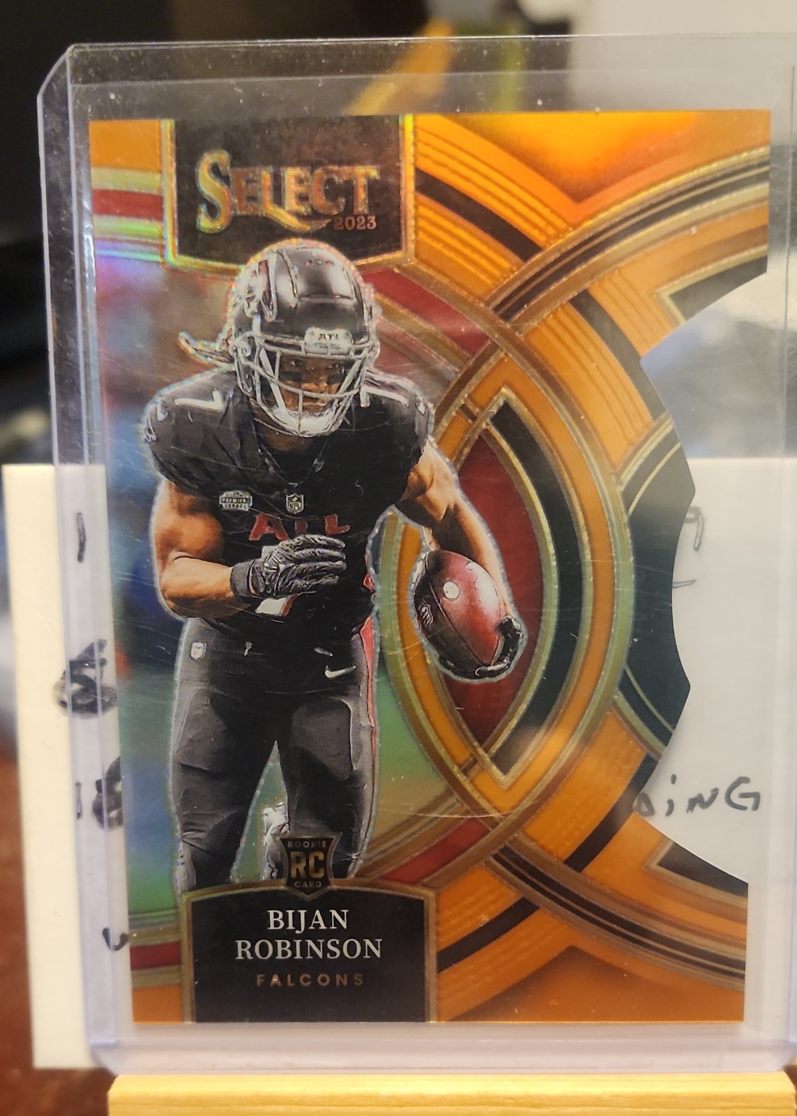 2023 Select - Premier Level Bijan Robinson Orange Prizm Die-Cut 287/399 (RC)