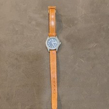 Analog Wristwatch Brown Leather Strap Black Dial Silver Accents Arabic Numerals