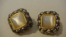 VINTAGE MARKED CROWN PD PREMIER DESIGNS CLIP ON EARRINGS WITH CENTER MILKY GLASS