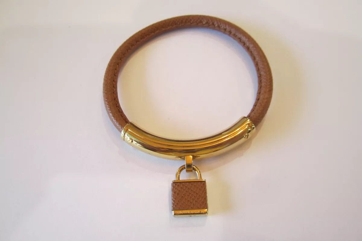 Michael kors lock best sale bangle