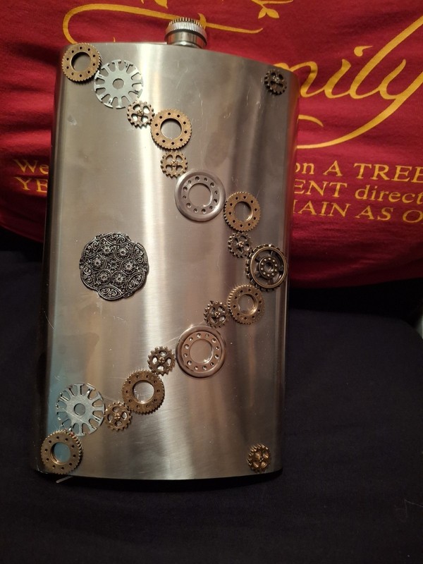 STEAMPUNK THEMED 64 OZ STAINLESS FLASK NEVER USED. VERY UNIQUE. 