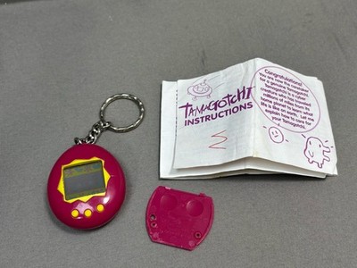 Original 1997 Bandai's Tamagotchi Virtual Reality Pet, Pink & Yellow~ Read