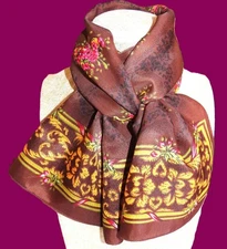 Oblong floral scarf; brown black gold pink red green; 46x10; poly?