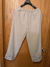 A Pair of J.Jill beige linen cropped pants with an elastic