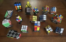 Rubik's Cube Lot - 16 Cubes  1 Cube Game with 15 OEM display stands.