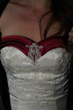 Beautiful wedding dress with deep red trim