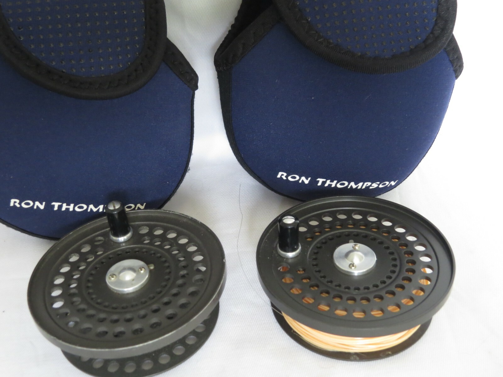 TWO ORVIS CFO 1V TROUT REEL SPARE SPOOLS IN A blueE POUCHES TWO ORVIS CFO 1V TROUT REEL SPARE SPOOLS IN A blueE POUCHES