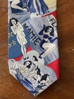 Ferrell Reed Hannoz Williams silk tie with vintage burlesque dancers, blue/red design, and “Made in U.S.A.” text.