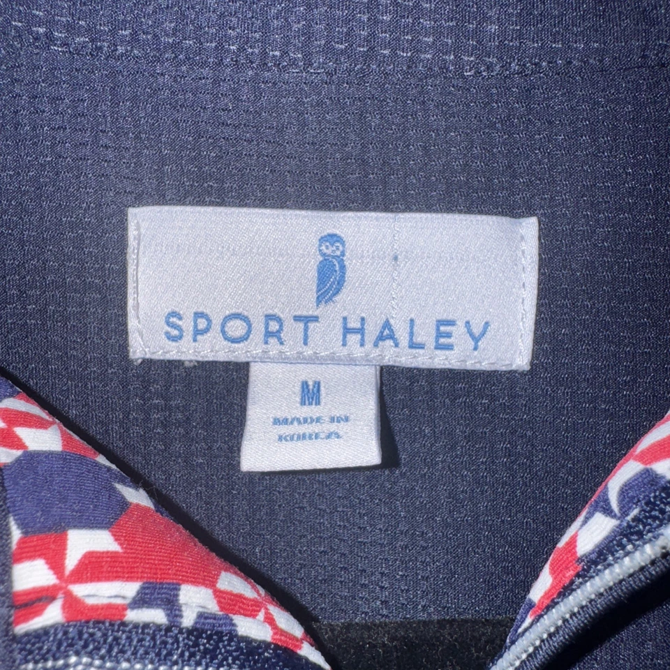 Polo de golf deportivo Haley patrón geométrico cuarto cremallera azul marino rojo blanco mediano Foto 3 de 4