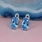 2.00 Ct Oval Cut Simulated Blue Topaz Halo Stud Earrings 14K White Gold Plated