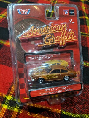 NIB MOTOR MAX AMERICAN GRAFFITI 1976 GOLD CHEVY VEGA 1:64 DIECAST