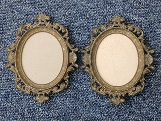 A Pair Of Antique Style Small Oval Rococco style brass Frames for miniatures