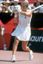 Monica Seles of Yugoslavia hits a return at a women's singles matc- Old Photo 15