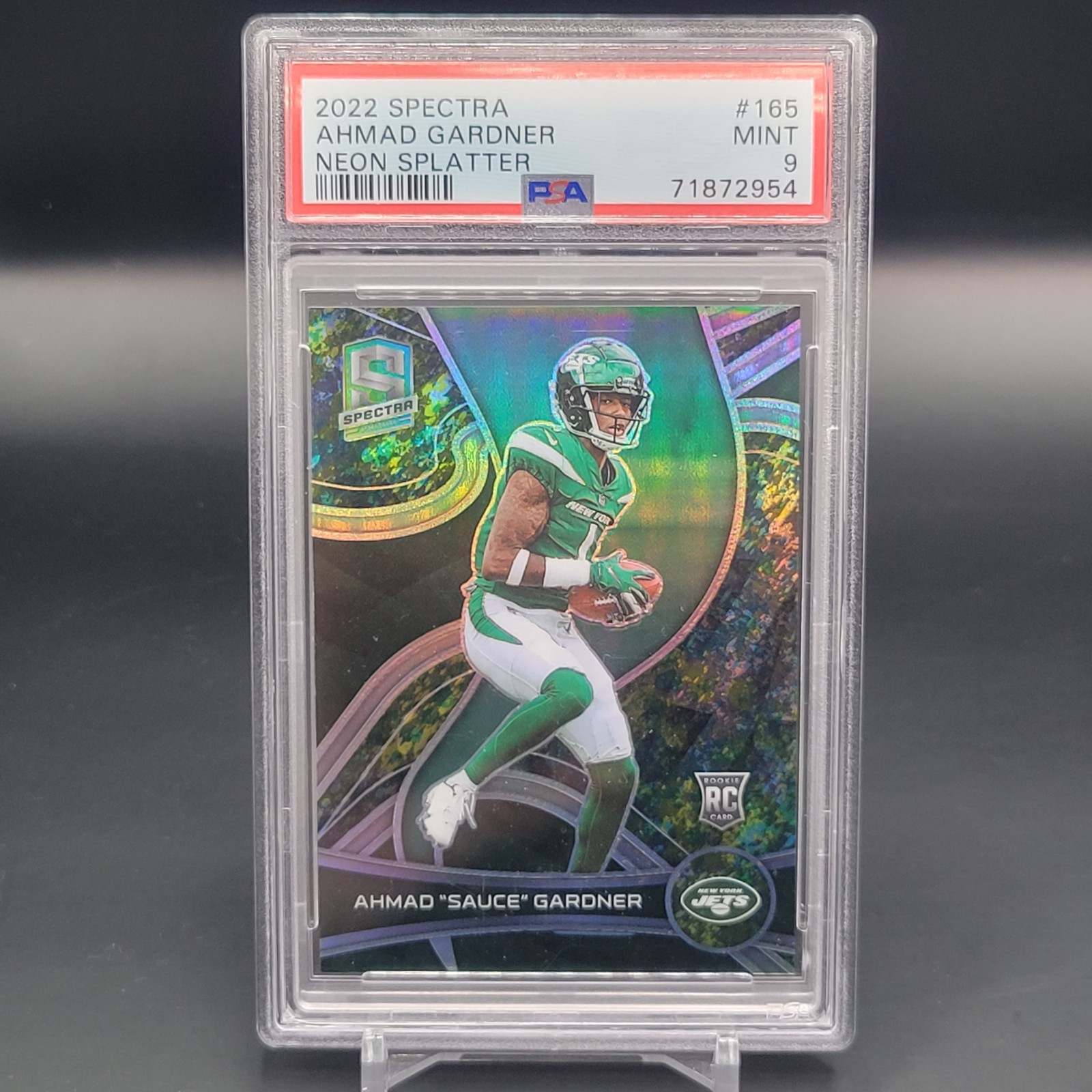 2022 Spectra Rookie Ahmad Sauce Gardner #165 Splatter Prizm JERSEY #1/8 Rc PSA 9