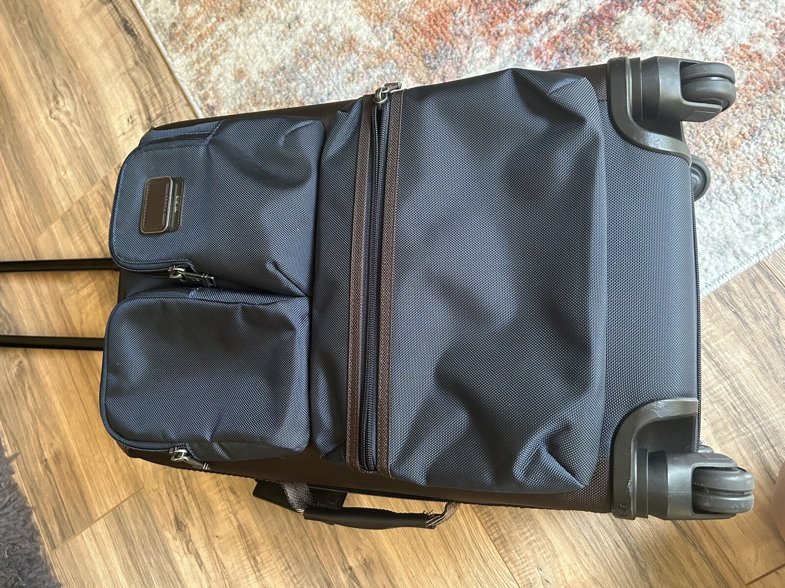 TUMI Briley International Expandable Luggage Rolling Spinner Blue