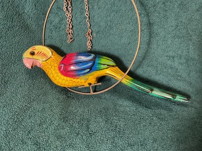 Vintage tropical bird hanging on hoop and chain parrot mccaw