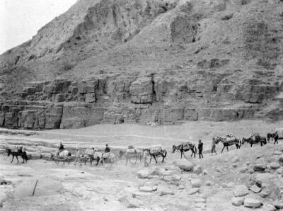 Shanxi province China, pack train of mules passing rock formations OLD PHOTO