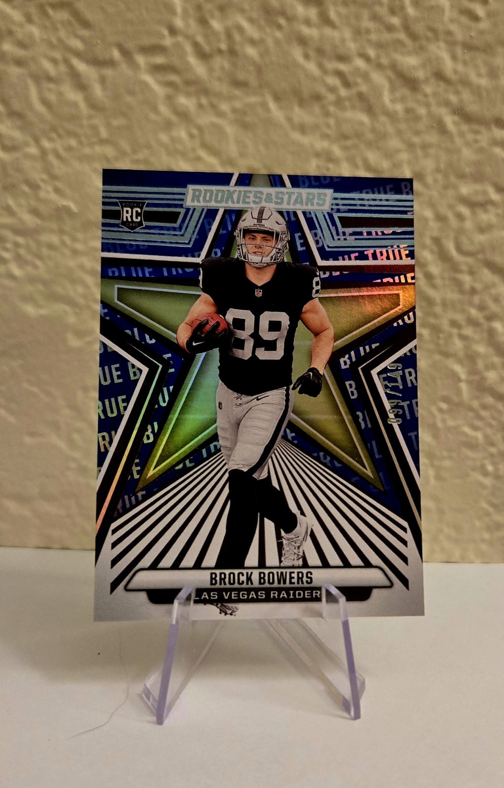 2024 Panini Rookies & Stars - Rookies Brock Bowers #114 True Blue /149 (RC)