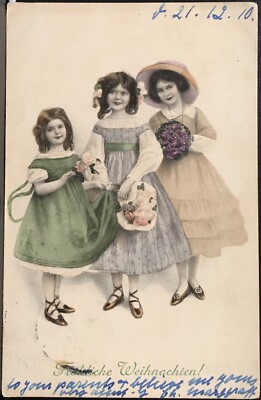 Christmas Postcard by M.M. Vienne ~ Three Beautiful Little Girls Holding Flowers