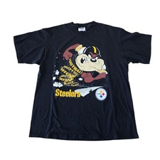 Vintage 1990s Pittsburgh Steelers Taz Football Graphic Sweatshirt.
