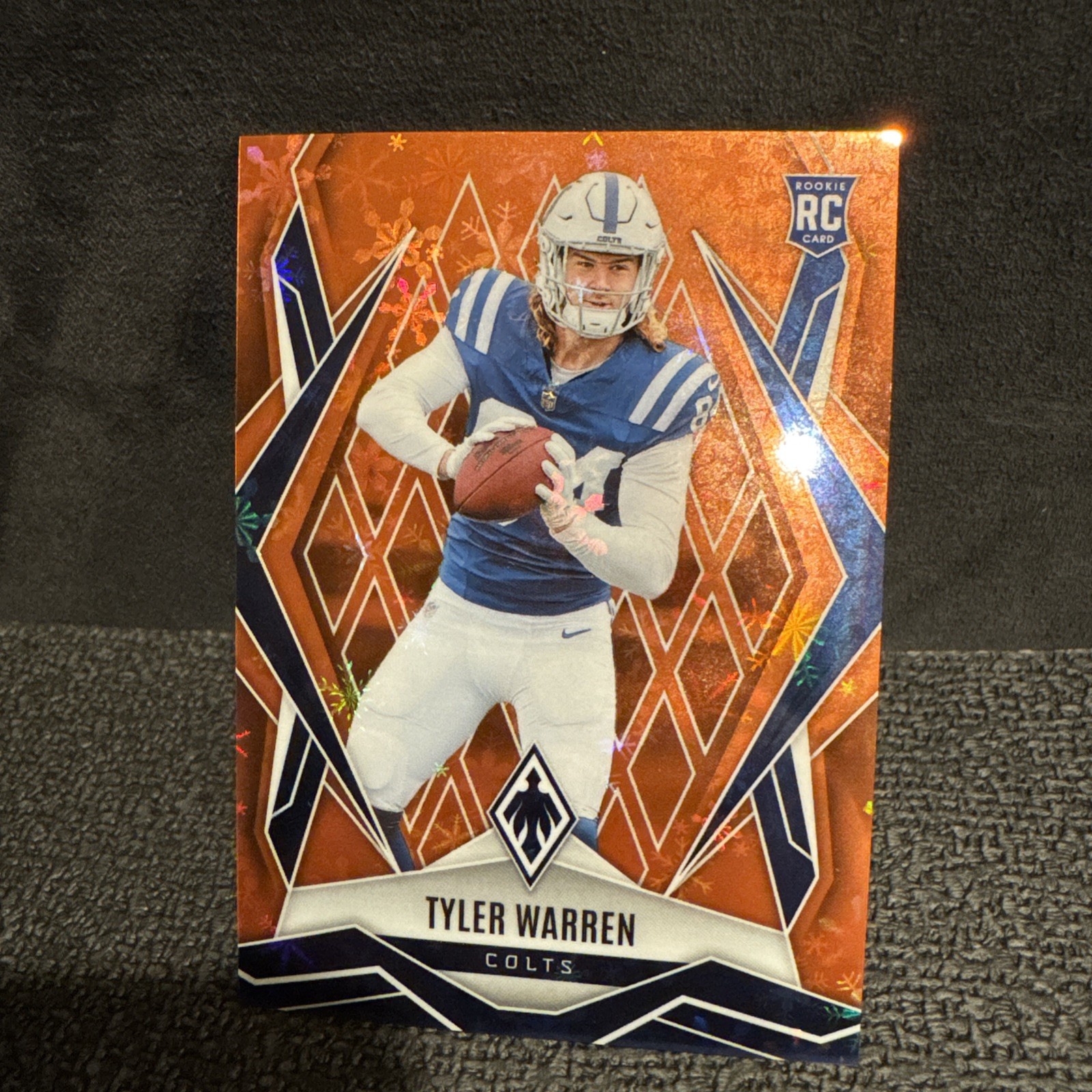 2025 Panini Phoenix - Rookies Tyler Warren #185 Orange Winter 63 /99 (RC) Colts