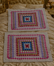 Two quilted patchwork pillow shams, 20 × 26