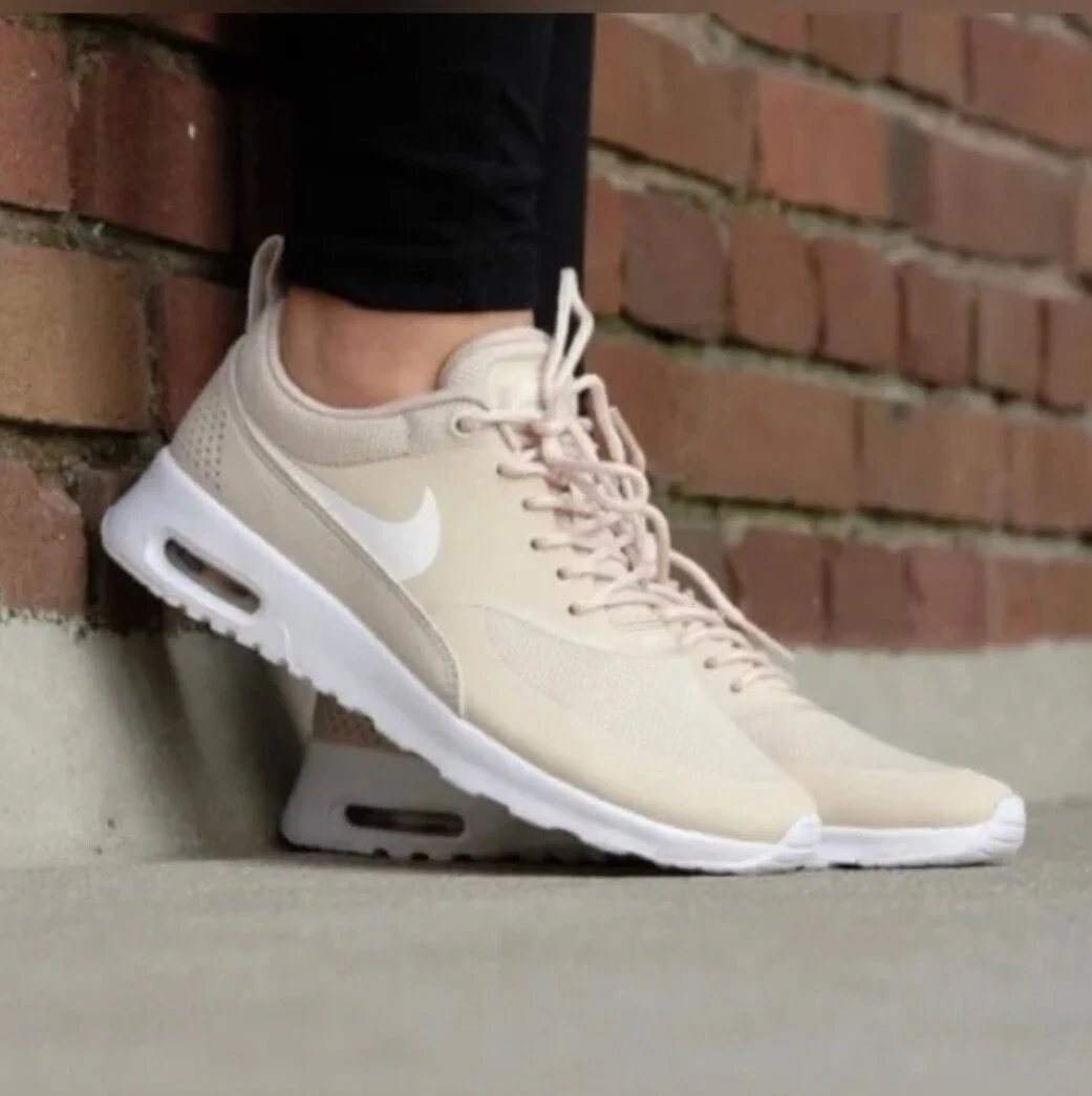 Beige nike thea sales