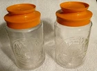Set Of 2 Vintage Anchor Hocking Glass Jars Orange Covered Cabin Jars With Lids *