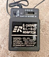 Universal AC/DC power adapter with Multiple Outputs