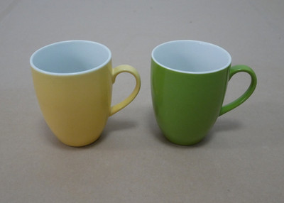 2x Tchibo TCM Kaffeebecher Henkelbecher - gelb grün