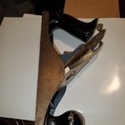 Vintage blackhawk C557MP wood hand plane with smooth bottom and worn brass handles on a white surface.