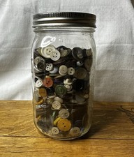 Vintage wide-mouth Ball mason jar full of misc vintage buttons
