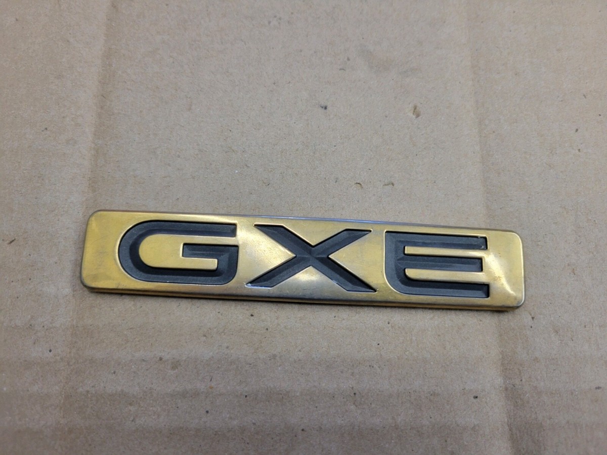 Nissan OEM 1993-1998 Quest GXE Gold Emblem Badge Logo Nameplate
