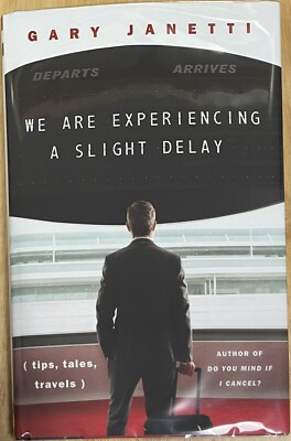 We Are Experiencing a Slight Delay : (tips, Tales, Travels) by Gary Janetti...