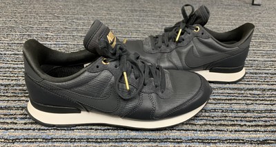 nike black and gold internationalist sneakers