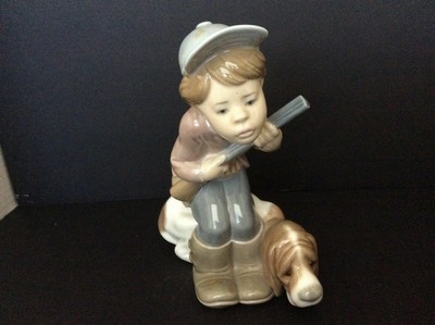 lladro boy sitting with dog