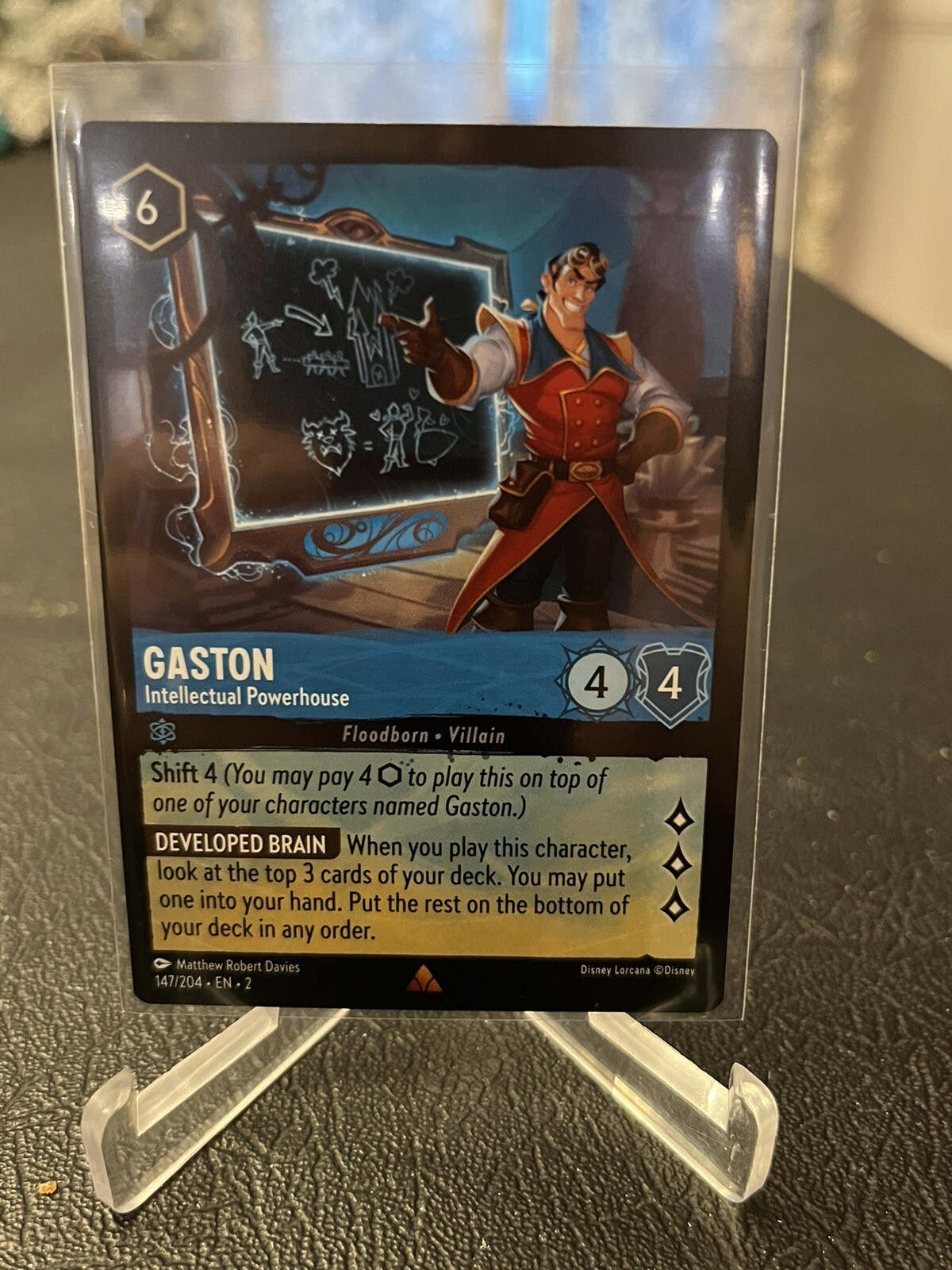 DISNEY LORCANA: RISE OF THE FLOODBORN - GASTON 147/204 RARE NM