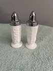 Vintage Milk Glass Pair of Salt and Pepper Shakers with Silver Tone Metal Lids.