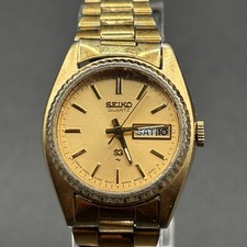 Seiko SQ Ladies Gold-Tone 24mm Day/Date Watch w/ Fluted Bezel 8523-0059