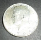 One 1964 Kennedy Half Dollar 90% Silver.  Great Luster.