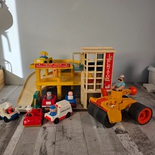 Fisher Price multi-story garage with Steam Roller Husky Helper and cars