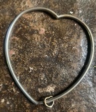 Heart shaped sterling silver bangle with peti...