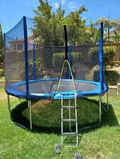 12 ft trampoline with safety net enclosure - Barely Used - Jumped on 5-10 Times