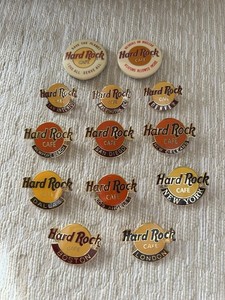 13 Hard Rock Broach Pins, 11 are City Pins