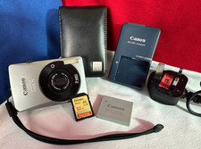 CANON IXUS 75 DIGITAL CAMERA 32GB SD MEMORY CARD ORIGINAL BATTERY CHARGER & CASE